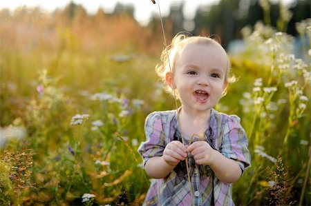 simsearch:400-04067084,k - Little baby in a meadow during sunset Stock Photo - Budget Royalty-Free & Subscription, Code: 400-05165274