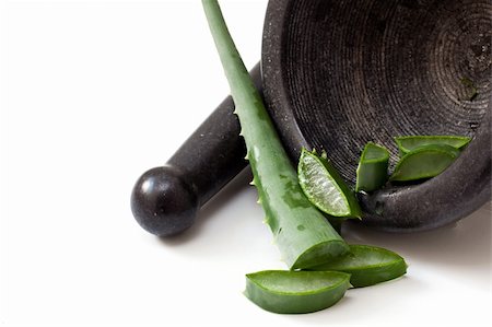 preparing aloe on a black old mortar and pestle Stock Photo - Budget Royalty-Free & Subscription, Code: 400-05165600