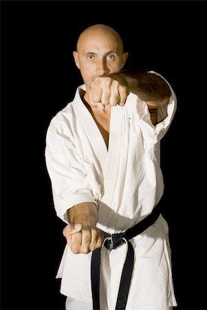 simsearch:400-04836306,k - The serious karateka men is fighting Photographie de stock - Aubaine LD & Abonnement, Code: 400-05165702