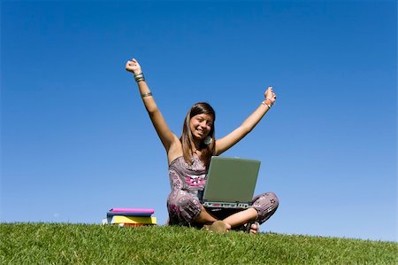 simsearch:6109-06003526,k - Happy young girl reading something on her laptop Stock Photo - Budget Royalty-Free & Subscription, Code: 400-05166079