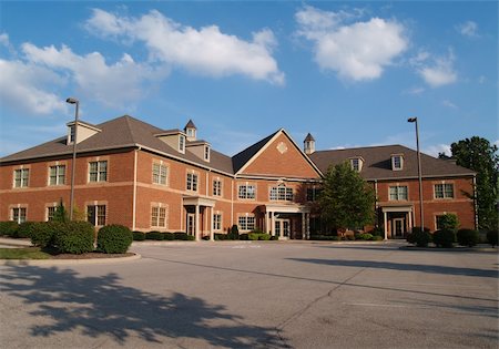 Two story red brick office building with parking spaces. Stock Photo - Budget Royalty-Free & Subscription, Code: 400-05166517