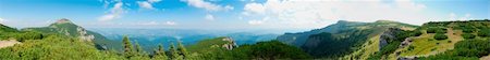 Beautiful panorama from Ceahlau mountain, Romania.  At right appears Ocolasul Mare, a scientific reservation, restricted area.  In the middle background is Izvorul muntelui lake and at left is Toaca peak, 1900 m. Stock Photo - Budget Royalty-Free & Subscription, Code: 400-05166706