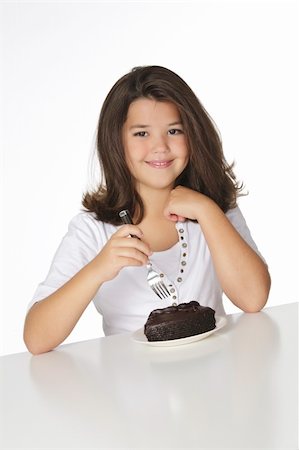 simsearch:400-04637126,k - Cute Caucasian child eating a slice of chocolate cake Foto de stock - Royalty-Free Super Valor e Assinatura, Número: 400-05167601