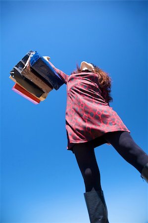 woman on red dress with shopping bags Stock Photo - Budget Royalty-Free & Subscription, Code: 400-05167749