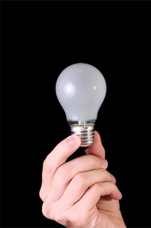 hand with lightbulb on black background Stock Photo - Budget Royalty-Free & Subscription, Code: 400-05167796