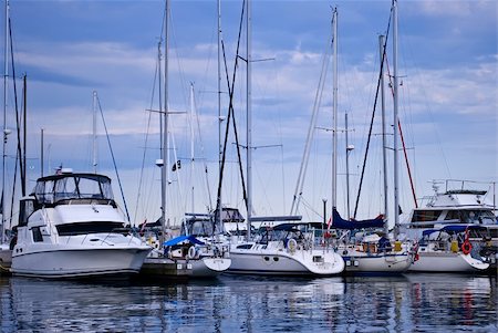 Luxury yachts moored in harbor with reflections in water Stockbilder - Microstock & Abonnement, Bildnummer: 400-05167820