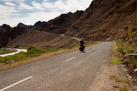 simsearch:400-05168151,k - Man travelling by bicycles in Iran. Aras river and mountain Stock Photo - Budget Royalty-Free & Subscription, Code: 400-05167882