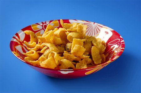 sweet and salty - Fried corn golden snack in plate over blue background Stock Photo - Budget Royalty-Free & Subscription, Code: 400-05167916