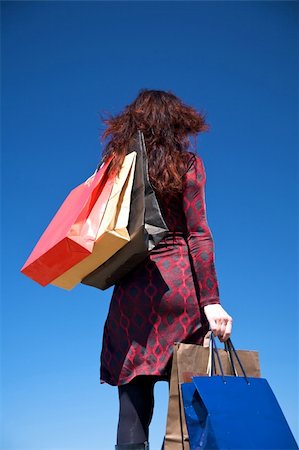 woman on red dress with shopping bags Stock Photo - Budget Royalty-Free & Subscription, Code: 400-05167977