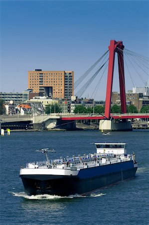 simsearch:400-06078495,k - Rotterdam. Maas river and a cargo ship. Willemsbrug on the background Foto de stock - Super Valor sin royalties y Suscripción, Código: 400-05168023