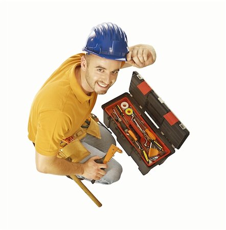 simsearch:400-04186152,k - smiling young handyman with toolsbox isolated on white Fotografie stock - Microstock e Abbonamento, Codice: 400-05168180