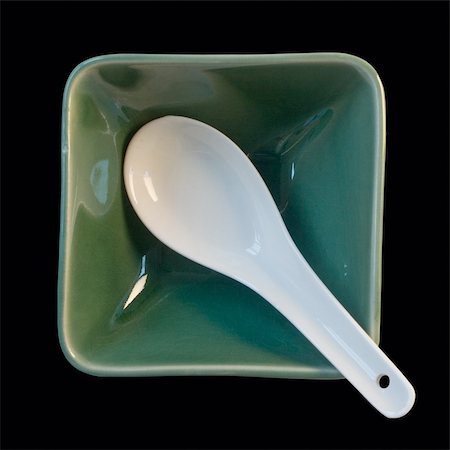 simsearch:400-06689258,k - white spoon in green cup isolated on black Stock Photo - Budget Royalty-Free & Subscription, Code: 400-05168487