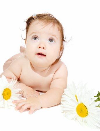 Baby girl with camomiles, looking up Stock Photo - Budget Royalty-Free & Subscription, Code: 400-05168822