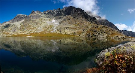 quite - A mountain lake mirroring a peaks in background Stock Photo - Budget Royalty-Free & Subscription, Code: 400-05168870