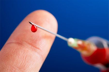 diabetes care - syringe needle with droplet of blood in front of a finger and on blue background Stock Photo - Budget Royalty-Free & Subscription, Code: 400-05169295