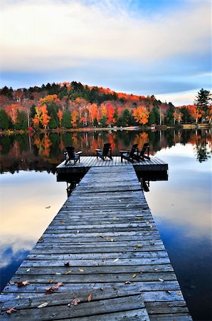 Wooden dock with chairs on calm fall lake Stock Photo - Budget Royalty-Free & Subscription, Code: 400-05169586