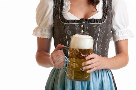 simsearch:400-04680527,k - Close-up of a Bavarian Girl dressed with a traditional Dirndl cloth holding a full Oktoberfest Beer Stein in her hands Stockbilder - Microstock & Abonnement, Bildnummer: 400-05160223