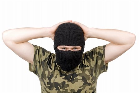 The surrendered terrorist in a black mask over white Foto de stock - Super Valor sin royalties y Suscripción, Código: 400-05160674