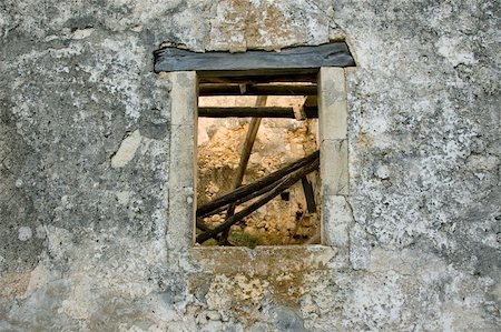 simsearch:400-05352419,k - Stone wall and window detail. Abandoned house exterior. Photographie de stock - Aubaine LD & Abonnement, Code: 400-05160789