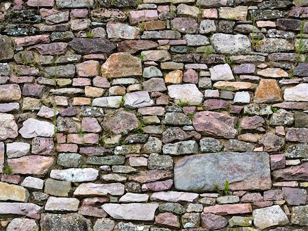 Old wall of stones of a medieval castle Foto de stock - Super Valor sin royalties y Suscripción, Código: 400-05160800