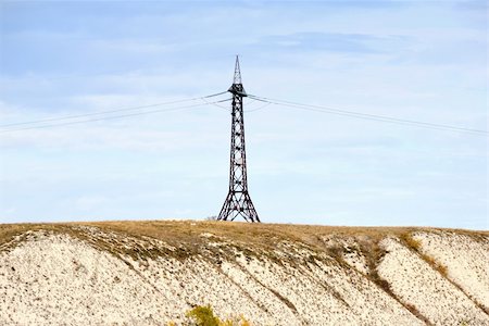 simsearch:400-09274553,k - High voltage line and electricity pylon on cretaceous mountains on a coastaline of the river Don. Russia. Stock Photo - Budget Royalty-Free & Subscription, Code: 400-05161347