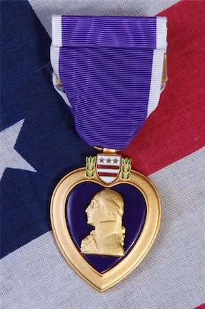 American Purple Heart Medal on a USA red white and blue  Flag Background. Stock Photo - Budget Royalty-Free & Subscription, Code: 400-05161614