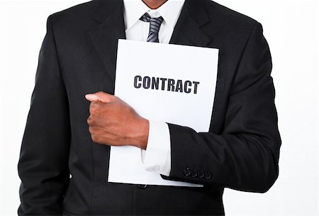 simsearch:400-04184820,k - Close-up of an African businessman holding a contract isolated against white Foto de stock - Super Valor sin royalties y Suscripción, Código: 400-05162044