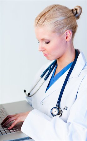 doctor business computer - Young attractive Female doctor working on a laptop Stock Photo - Budget Royalty-Free & Subscription, Code: 400-05162109