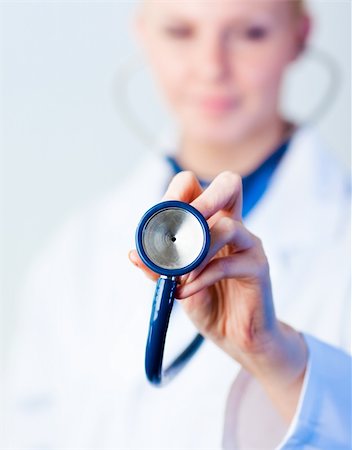 simsearch:400-05741224,k - Doctor holding a stethescope out with the focus on the stethescope Stock Photo - Budget Royalty-Free & Subscription, Code: 400-05162111