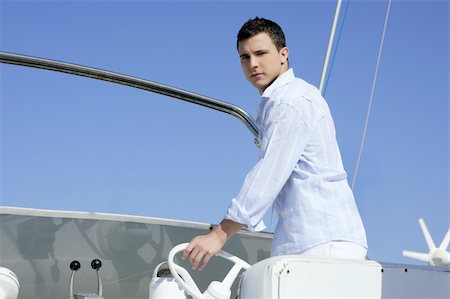 Handsome young man on boat, blue summer vacation outdoor Stock Photo - Budget Royalty-Free & Subscription, Code: 400-05162678