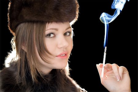 simsearch:400-04631926,k - Portrait of the beautiful woman with a cigarette Stock Photo - Budget Royalty-Free & Subscription, Code: 400-05163573