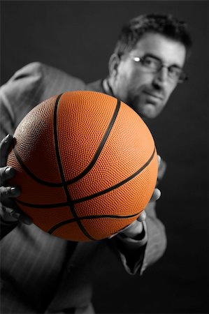 Businessman with basketball ball, teamwork, leadership metaphor Stock Photo - Budget Royalty-Free & Subscription, Code: 400-05163589