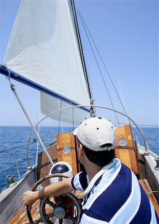 simsearch:400-04475224,k - Sailor sailing in the sea. Sailboat over mediterranean blue saltwater Foto de stock - Super Valor sin royalties y Suscripción, Código: 400-05163603