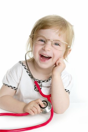 Cute little girl pretending to be a doctor with stethoscope over white Stock Photo - Budget Royalty-Free & Subscription, Code: 400-05163770