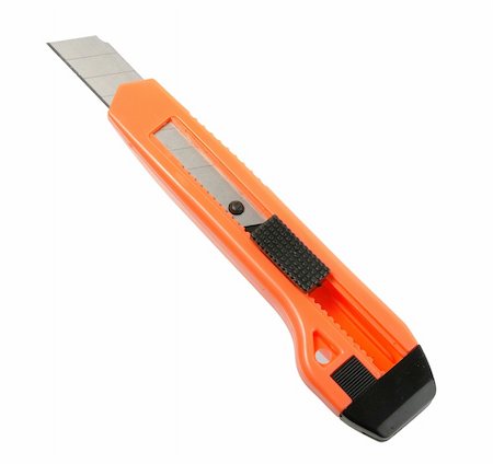 Orange paper knife. Close-up. Isolated on white. Foto de stock - Super Valor sin royalties y Suscripción, Código: 400-05163787