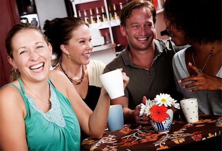 Diverse group of four friends in a coffee house Stock Photo - Budget Royalty-Free & Subscription, Code: 400-05163809