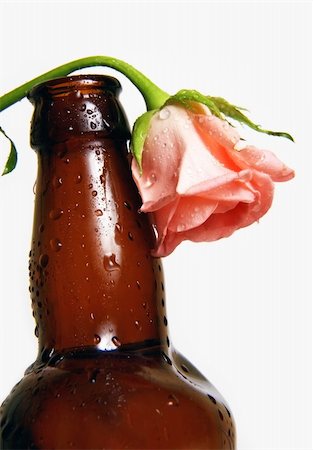 simsearch:400-07829164,k - Curve brown bottle with flower on a white background Stock Photo - Budget Royalty-Free & Subscription, Code: 400-05174146