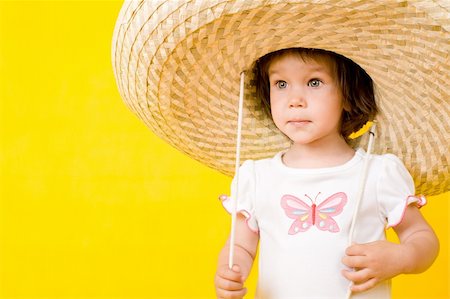 simsearch:400-04093413,k - Little baby with big hat, Isolated on yellow Stock Photo - Budget Royalty-Free & Subscription, Code: 400-05174351