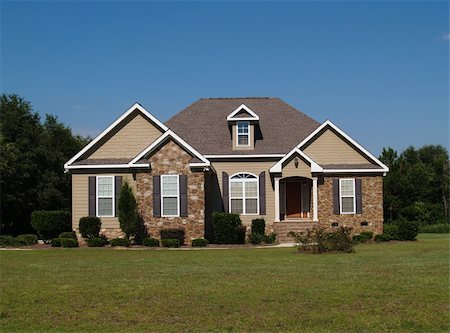 stone exterior suburban home - Single story stone and vinyl residential home. Stock Photo - Budget Royalty-Free & Subscription, Code: 400-05174536