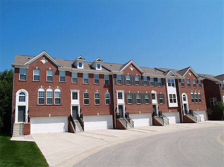 family in a suburban community - Red brick condos or town homes with the garage in the front. Stock Photo - Budget Royalty-Free & Subscription, Code: 400-05174805