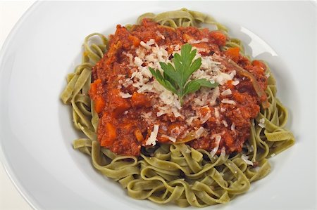 tagliatelle with sauce bolognaise in white plates Stock Photo - Budget Royalty-Free & Subscription, Code: 400-05174965