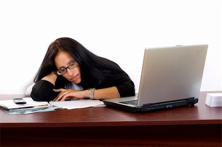 executive sleeping desk - Beautiful business woman laying on desk and sleeping Stock Photo - Budget Royalty-Free & Subscription, Code: 400-05175837