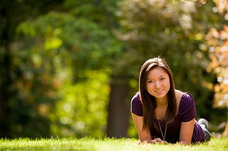 A teenage girl on grass Photographie de stock - Aubaine LD & Abonnement, Code: 400-05175877