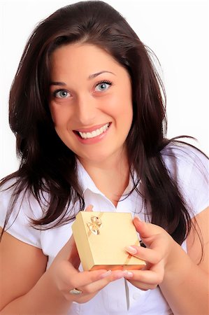 simsearch:400-04821712,k - Girl holding a gift in packing Stock Photo - Budget Royalty-Free & Subscription, Code: 400-05176499