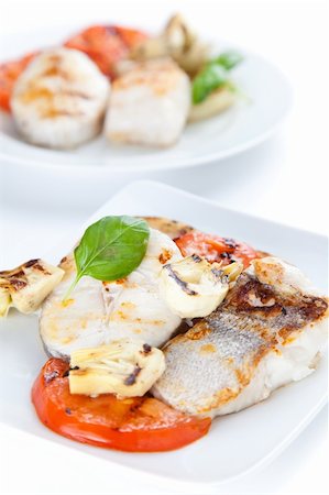 fresh slice of hake baked with vegetables Fotografie stock - Microstock e Abbonamento, Codice: 400-05177080