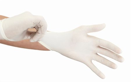 rubber hand gloves - Doctor gets ready for a medical procedure. Stock Photo - Budget Royalty-Free & Subscription, Code: 400-05177117