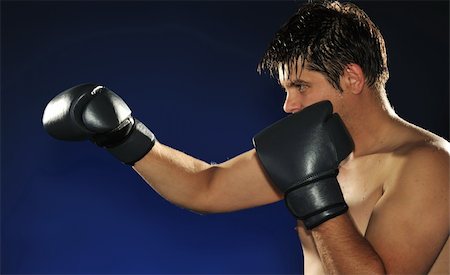 simsearch:400-08333281,k - The boxer. The young man in boxing gloves Stock Photo - Budget Royalty-Free & Subscription, Code: 400-05177226