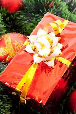 simsearch:400-05177572,k - Red Christmas balls and presents  among green new year tree Stock Photo - Budget Royalty-Free & Subscription, Code: 400-05177586