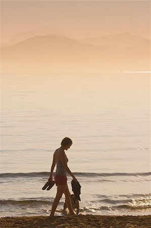 young girls walks at a beach in the morning Stock Photo - Budget Royalty-Free & Subscription, Code: 400-05177607