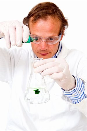 Chemist, diluting a green substance in a measuring beaker Stock Photo - Budget Royalty-Free & Subscription, Code: 400-05177697